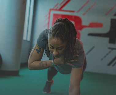 African American Women Working out Shoulder Tap Exercise