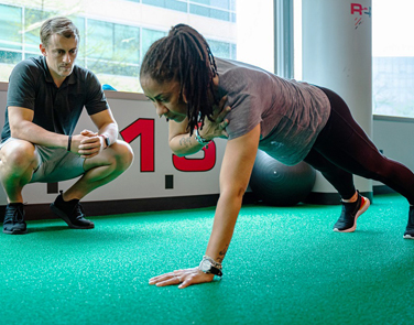 Rehab 2 perform sports rehabilitation woman in sports rehab working her arms