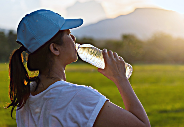 runner drinking water hydration
